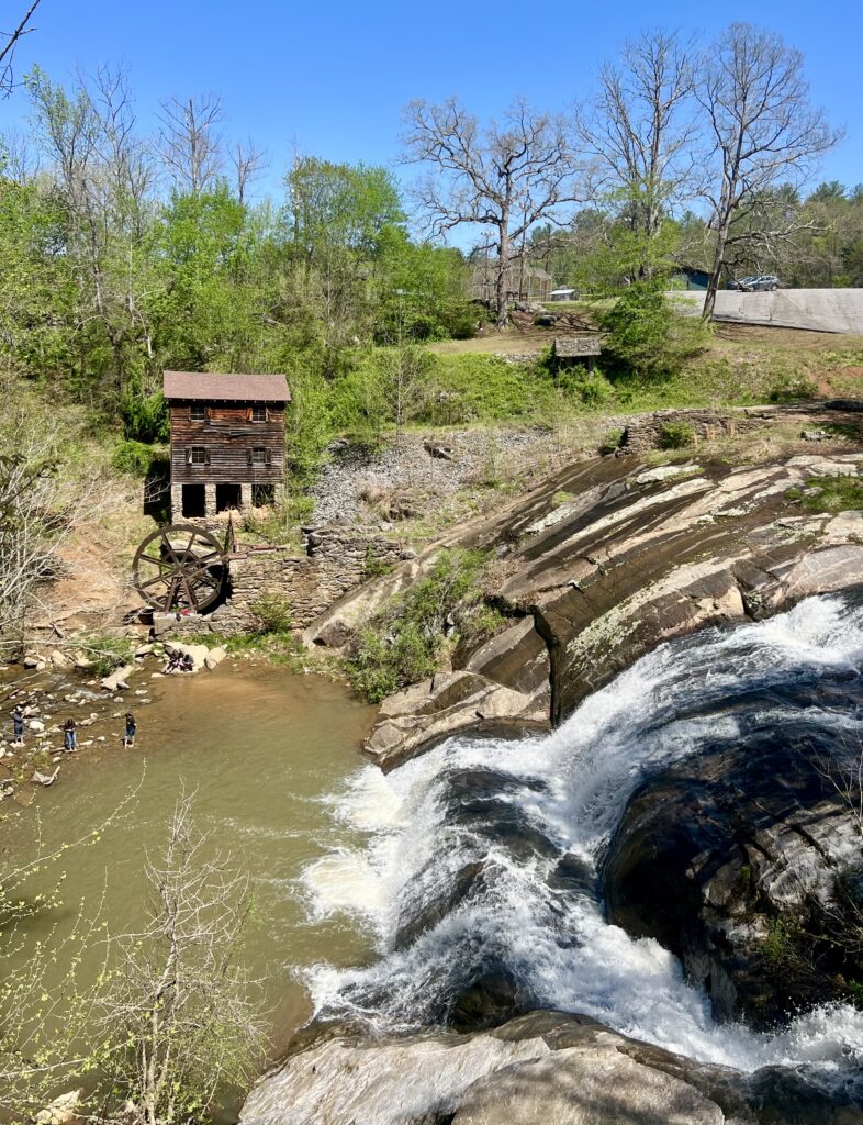 mcgalliard falls in valdese north carolina as seen from above with meytre grist mill visible to the left
