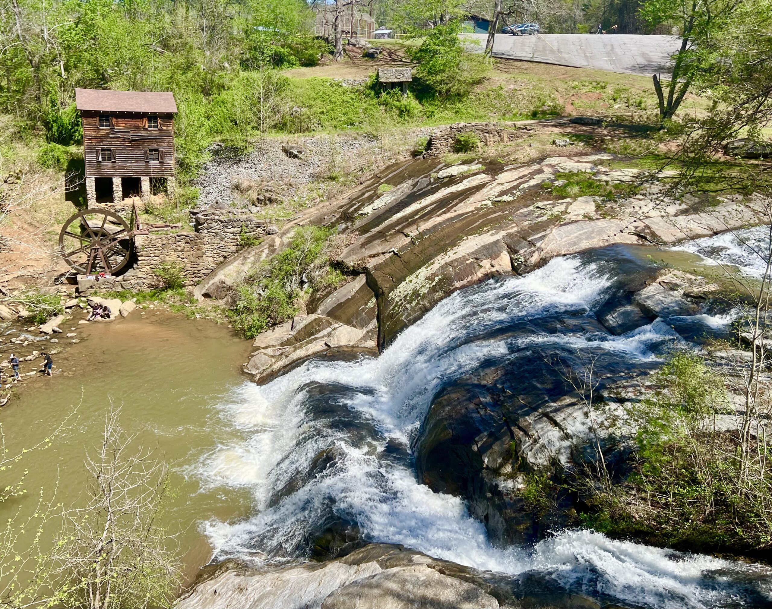mcgalliard falls in valdese nc as seen from above with historic meytre grist mill to the left of them